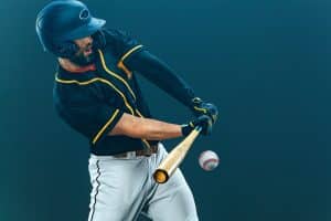 Baseball player with bat taking a swing