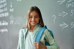 View of a student smiling at the camera.