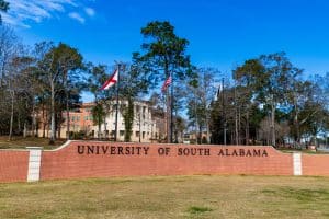 The University of South Alabama sign and flags