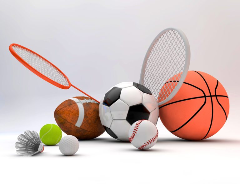 View of sports equipments placed next to each other on the floor.