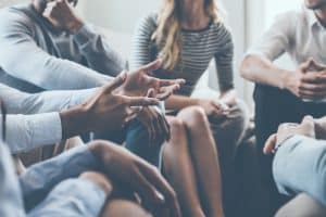 Close up of a discussion of people while in a room.