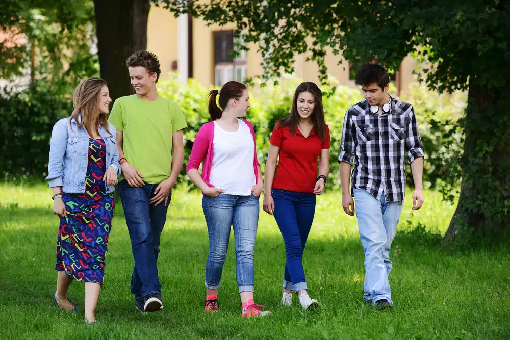 Group of students walking in the school.