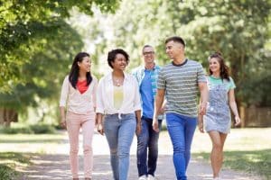 Group of students walking in the campus.