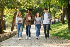 Group of students walking in the school campus.
