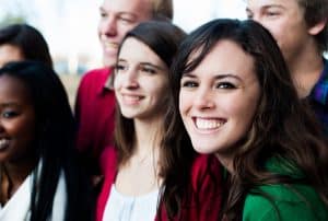 Group of women smiling at the camera.