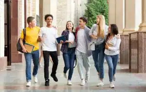 Group of students walking in the campus.