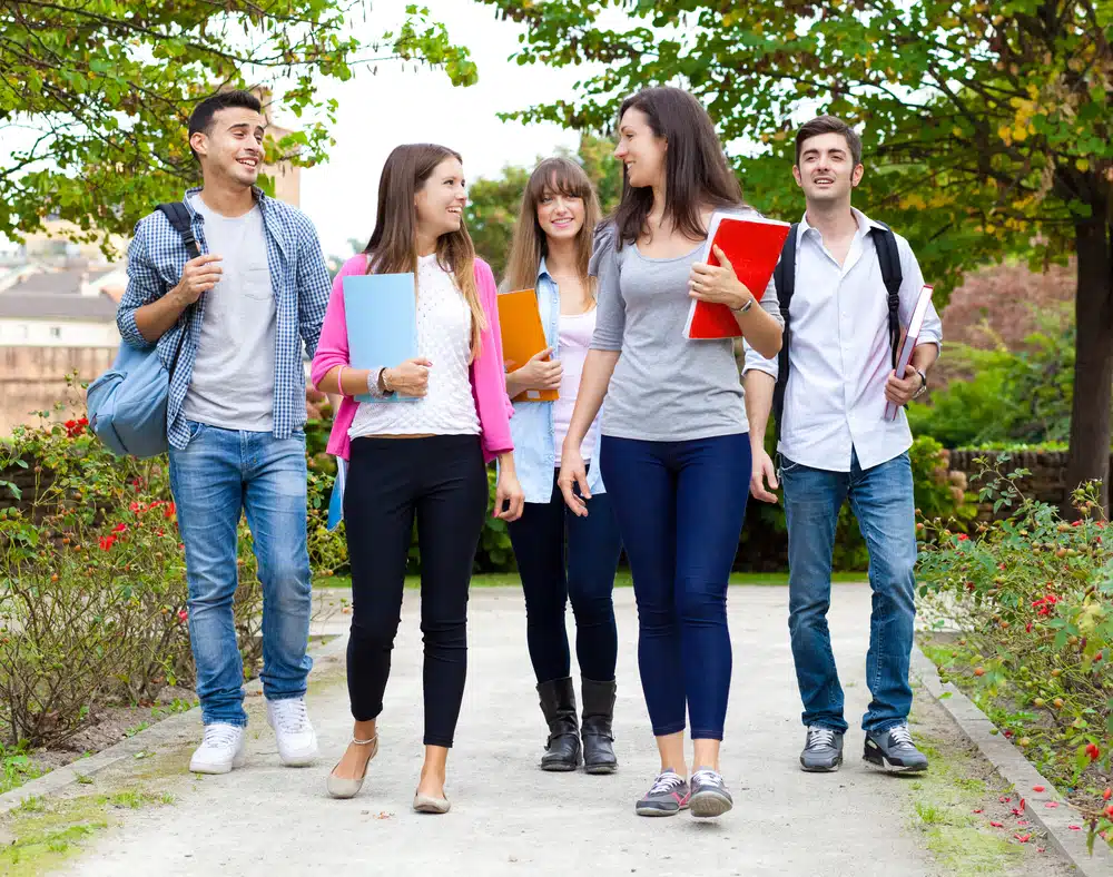 Group of students walking in the campus.