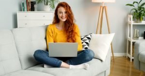 View of a woman using a laptop.