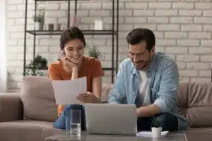 Two people talking in a living room.