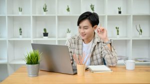 View of a man using a laptop.