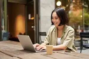 View of a woman using a laptop.