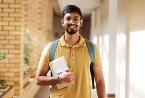 View of a student smiling at the camera.