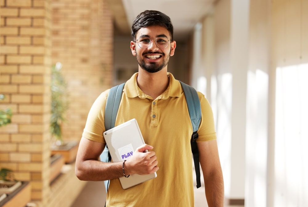 View of a student smiling at the camera.