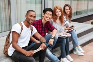 Group of students sitting on the stairs.