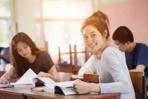 Group of students studying together in the library.