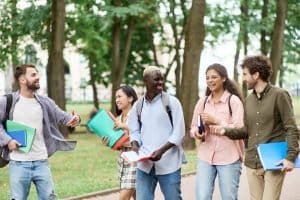 Group of students walking in the campus.