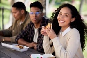 group of students eating burgers