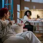 Students chatting in a dorm common area