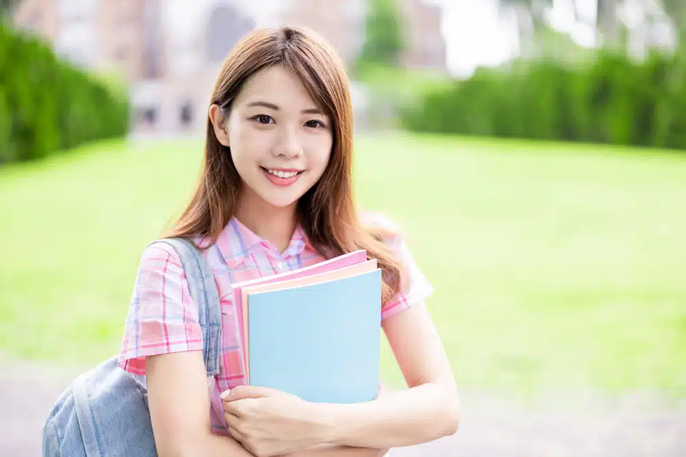 college student holding her books