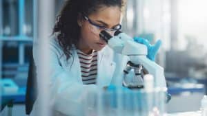 A student looking on the microscope