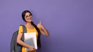 Happy female student wearing glasses