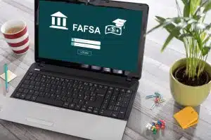 Laptop on a desk with fafsa concept on the screen