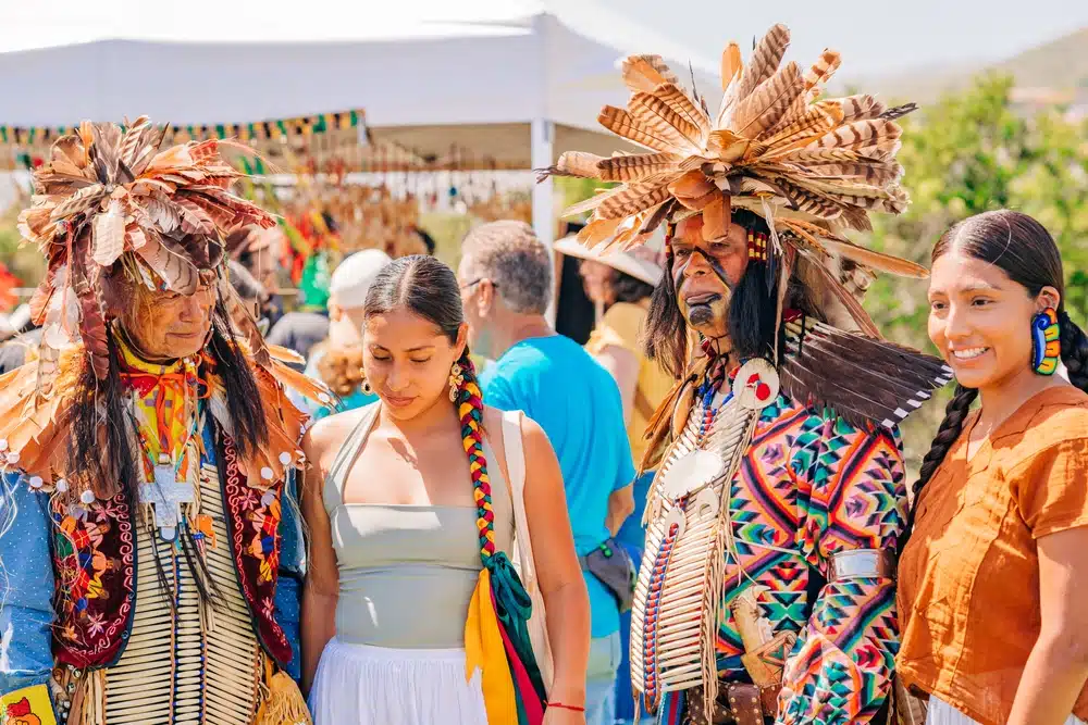 Native Americans dressed in full regalia.