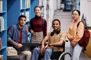 Diverse group of students with young man in wheelchair