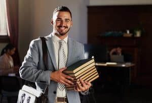 a college student holding books
