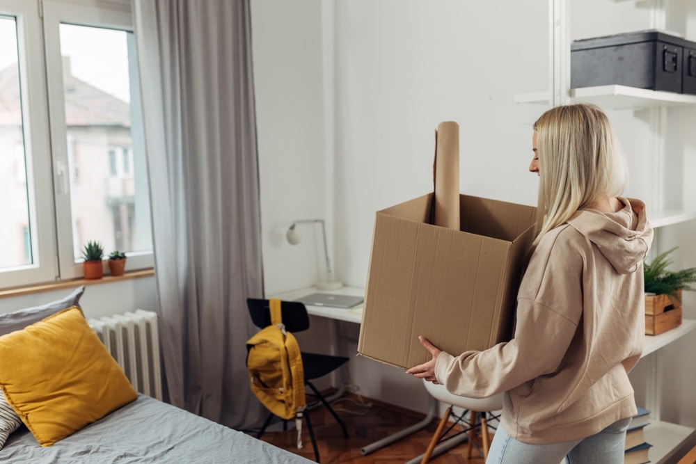female college student move in dorm.