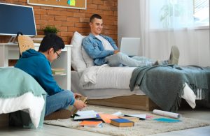 two college students inside their dorm