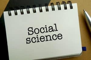 Social science memo written on a notebook with pen