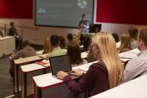 student using laptop computer at a university lecture