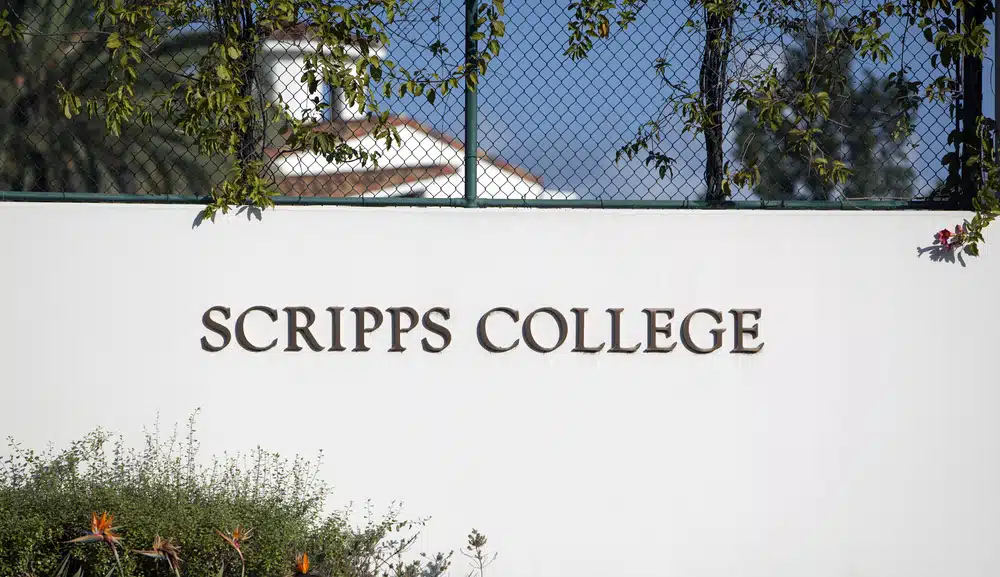 The sign welcoming visitors to Scripps College, part of the Claremont Colleges consortium, representing the selectivity and competitiveness reflected in Claremont Colleges acceptance rates.