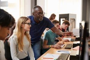 A teacher working with his students