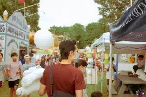 people in college campus fair