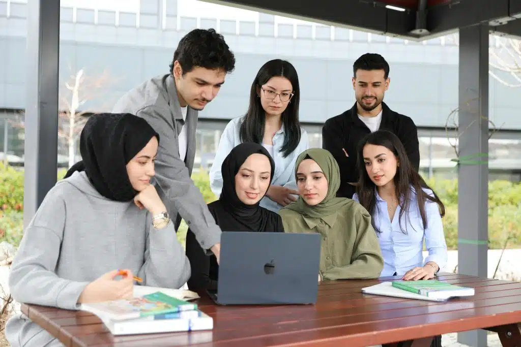 Students looking at a laptop for the Brookhaven HSRP program