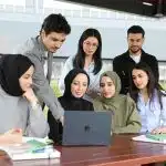 Students looking at a laptop for the Brookhaven HSRP program