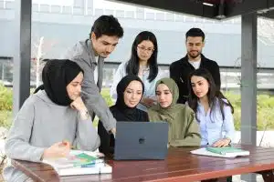 Students looking at a laptop for the Brookhaven HSRP program