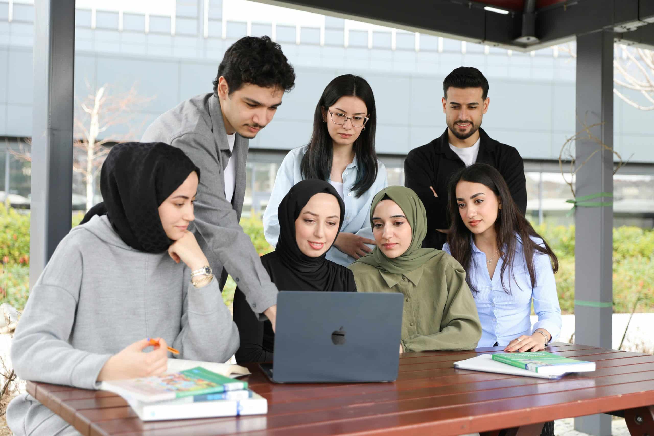 Students looking at a laptop for the Brookhaven HSRP program