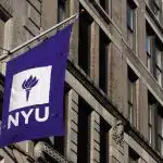 a photo of an NYU building with an NYU flag and the NYU application deadline