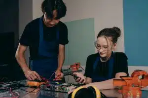 Two students working on a robotic project