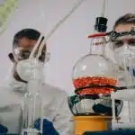 Two students checking on a science experiment