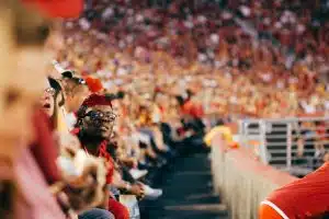 audience wearing red at a college football game