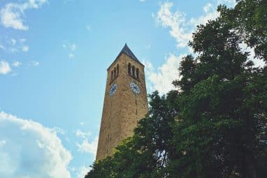 A low-angle shot of McGraw tower at Cornell