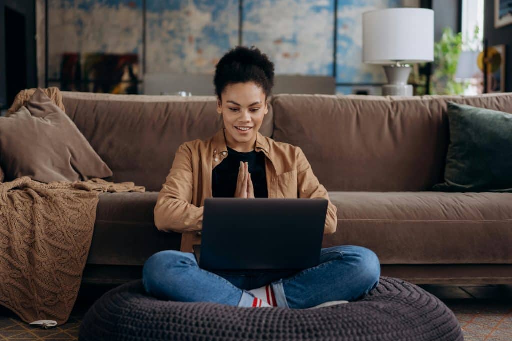 A student looks at a laptop while researching UChicago vs Brown.