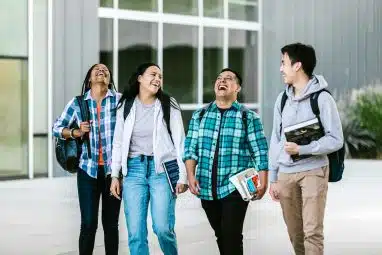 4 dartmouth students walking while laughing about likely letter