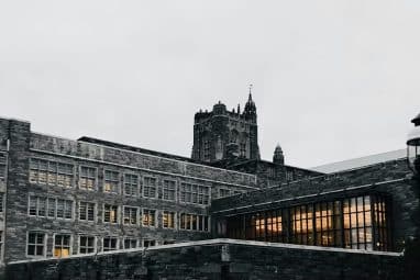 Princeton University campus building, home to students pursuing the most popular majors at Princeton, under a cloudy sky