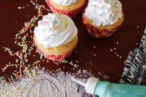 Cupcakes with whipped cream frosting and colorful sprinkles, styled to represent the best ways to announce college decision.