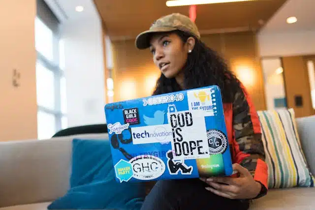 a female student researching about NYU vs Boston University